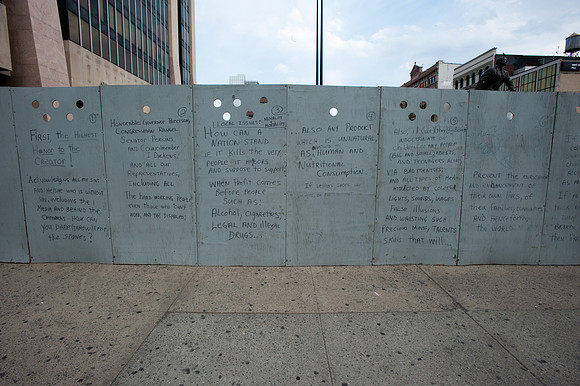 Literal protest on construction wall of Adam Powell State Office Building